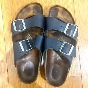 Navy blue Birkenstocks with silver buckles